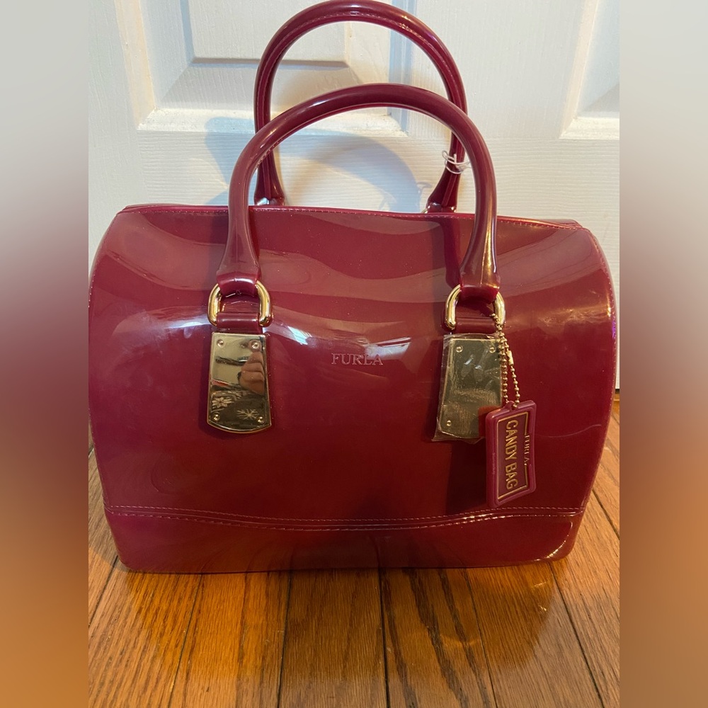 Furla Candy Bag NWT Purple and has Furla Bag Tag. Top Handle Carry